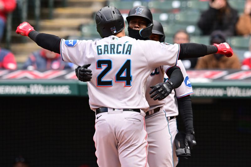 Apr 23, 2023; Cleveland, Ohio, USA; Miami Marlins designated hitter Avisail Garcia (24) celebrates with right fielder Jorge Soler (12) and left fielder Bryan De La Cruz (14) after hitting a three run home run during the eighth inning against the Cleveland Guardians at Progressive Field. Mandatory Credit: Ken Blaze-USA TODAY Sports