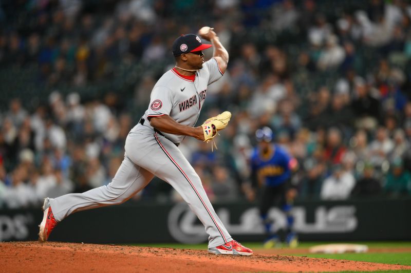 May 29, 2025; Seattle, Washington, USA; Washington Nationals relief pitcher Jose Ferrer (47) pitches to the Seattle Mariners during the eighth inning at T-Mobile Park. Mandatory Credit: Steven Bisig-Imagn Images