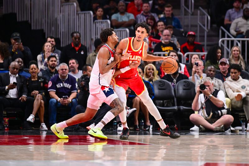 ATLANTA, GA - OCTOBER 28:  Zaccharie Risacher #10 of the Atlanta Hawks dribbles the ball during the game on October 28, 2024 at State Farm Arena in Atlanta, Georgia.  NOTE TO USER: User expressly acknowledges and agrees that, by downloading and/or using this Photograph, user is consenting to the terms and conditions of the Getty Images License Agreement. Mandatory Copyright Notice: Copyright 2024 NBAE (Photo by Adam Hagy/NBAE via Getty Images)