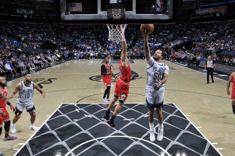 ORLANDO, FL - NOVEMBER 27: Cole Anthony #50 of the Orlando Magic drives to the basket during the game against the Chicago Bulls  on November 27, 2024 at Kia Center in Orlando, Florida. NOTE TO USER: User expressly acknowledges and agrees that, by downloading and or using this photograph, User is consenting to the terms and conditions of the Getty Images License Agreement. Mandatory Copyright Notice: Copyright 2024 NBAE (Photo by Fernando Medina/NBAE via Getty Images)