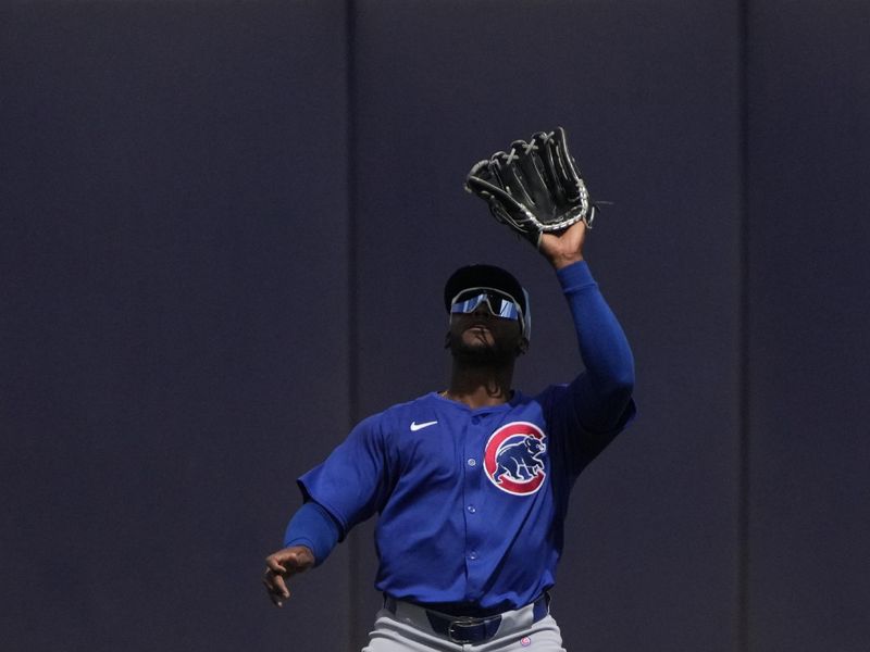 Mar 24, 2024; Peoria, Arizona, USA; Chicago Cubs center fielder Alexander Canario (4) makes the catch for an out against the Seattle Mariners in the first inning at Peoria Sports Complex. Mandatory Credit: Rick Scuteri-USA TODAY Sports