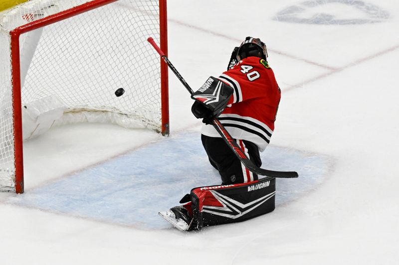 Apr 7, 2024; Chicago, Illinois, USA;  Chicago Blackhawks goaltender Arvid Soderblom (40) misses the save as Minnesota Wild center Marco Rossi (23) scores during the second period at United Center. Mandatory Credit: Matt Marton-USA TODAY Sports