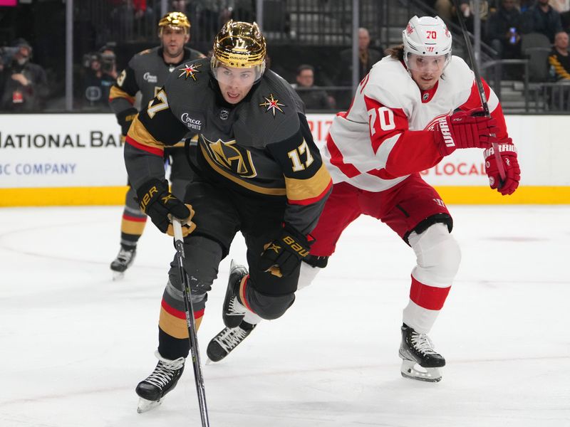 Jan 19, 2023; Las Vegas, Nevada, USA; Vegas Golden Knights defenseman Ben Hutton (17) and Detroit Red Wings center Oskar Sundqvist (70) skate towards the puck during the first period at T-Mobile Arena. Mandatory Credit: Stephen R. Sylvanie-USA TODAY Sports