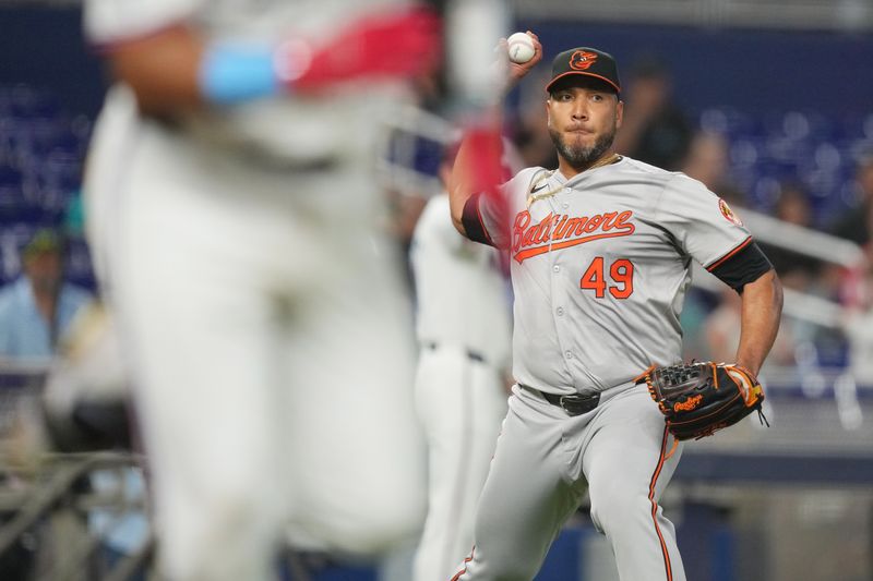 Jul 23, 2024; Miami, Florida, USA;  Baltimore Orioles starting pitcher Albert Suárez (49) throws out Miami Marlins catcher Ali Sánchez (47) in the second inning at loanDepot Park. Mandatory Credit: Jim Rassol-USA TODAY Sports