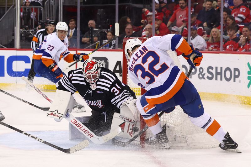 Apr 15, 2024; Newark, New Jersey, USA; New York Islanders center Kyle MacLean (32) scores a goal against the New Jersey Devils during the third period at Prudential Center. Mandatory Credit: Ed Mulholland-USA TODAY Sports