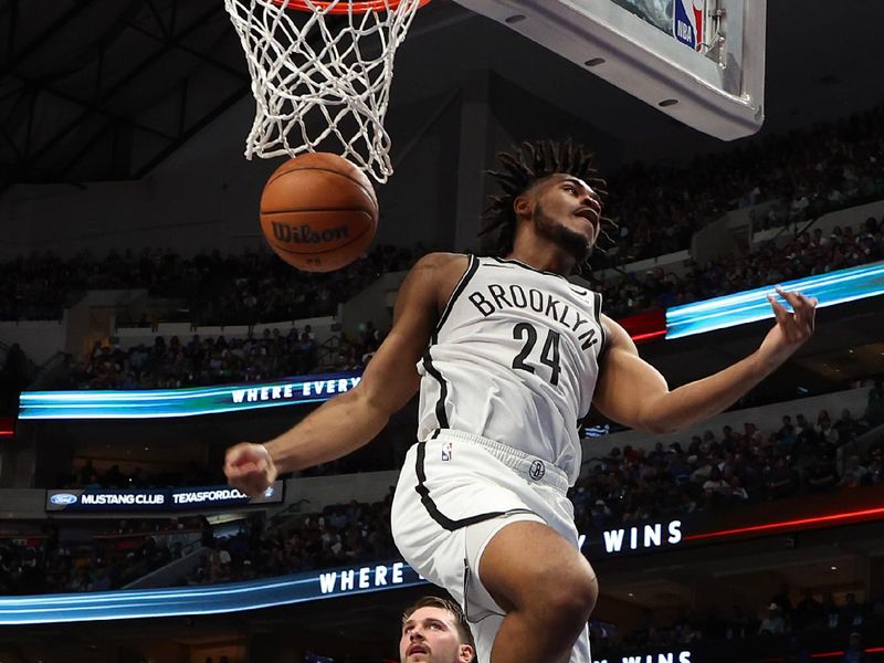 DALLAS, TEXAS - OCTOBER 27: Cam Thomas #24 of the Brooklyn Nets comes down after a dunk against the Dallas Mavericks in the fourth quarter at American Airlines Center on October 27, 2023 in Dallas, Texas. NOTE TO USER: User expressly acknowledges and agrees that, by downloading and or using this photograph, User is consenting to the terms and conditions of the Getty Images License Agreement. (Photo by Richard Rodriguez/Getty Images)