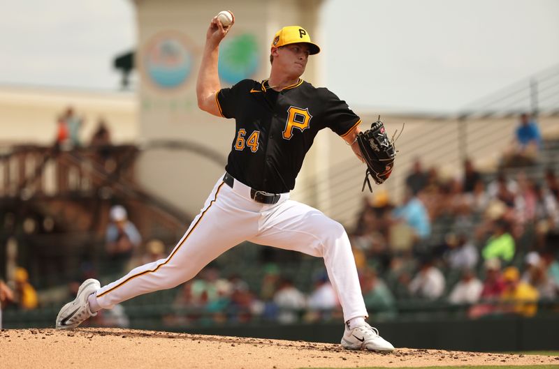 Mar 5, 2024; Bradenton, Florida, USA;  Pittsburgh Pirates starting pitcher Quinn Priester (64) throws a pitch during the third inning against the Toronto Blue Jays at LECOM Park. Mandatory Credit: Kim Klement Neitzel-USA TODAY Sports