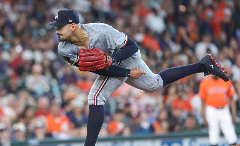 May 31, 2024; Houston, Texas, USA; Minnesota Twins starting pitcher Pablo Lopez (49) delivers a pitch during the first inning against the Houston Astros at Minute Maid Park. Mandatory Credit: Troy Taormina-USA TODAY Sports