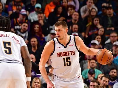 PHOENIX, AZ - DECEMBER 1: Nikola Jokic #15 of the Denver Nuggets dribbles the ball during the game against the Phoenix Suns on December 1, 2023 at Footprint Center in Phoenix, Arizona. NOTE TO USER: User expressly acknowledges and agrees that, by downloading and or using this photograph, user is consenting to the terms and conditions of the Getty Images License Agreement. Mandatory Copyright Notice: Copyright 2023 NBAE (Photo by Barry Gossage/NBAE via Getty Images)