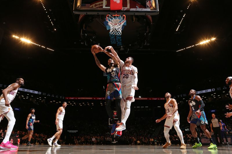 BROOKLYN, NY - JANUARY 31: Nicolas Claxton #33 of the Brooklyn Nets drives to the basket during the game against the Phoenix Suns on January 31, 2024 at Barclays Center in Brooklyn, New York. NOTE TO USER: User expressly acknowledges and agrees that, by downloading and or using this Photograph, user is consenting to the terms and conditions of the Getty Images License Agreement. Mandatory Copyright Notice: Copyright 2024 NBAE (Photo by Nathaniel S. Butler/NBAE via Getty Images)