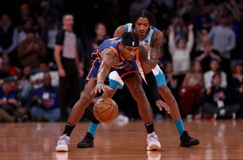 NEW YORK, NEW YORK - NOVEMBER 28:  Miles McBride #2 of the New York Knicks runs out the clock as Nick Smith Jr. #8 of the Charlotte Hornets defends during the second half of an NBA In-Season Tournament game at Madison Square Garden on November 28, 2023 in New York City. The New York Knicks defeated the Charlotte Hornets 115-91.NOTE TO USER: User expressly acknowledges and agrees that, by downloading and or using this photograph, User is consenting to the terms and conditions of the Getty Images License Agreement. (Photo by Elsa/Getty Images)