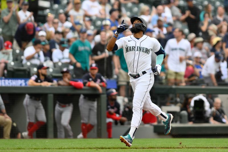 Jun 27, 2023; Seattle, Washington, USA; Seattle Mariners right fielder Teoscar Hernandez (35) crosses home plate after hitting a 2-run home run against the Washington Nationals during the first inning at T-Mobile Park. Mandatory Credit: Steven Bisig-USA TODAY Sports