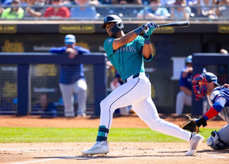 Mar 5, 2024; Peoria, Arizona, USA; Seattle Mariners outfielder Julio Rodriguez against the Texas Rangers during a spring training baseball game at Peoria Sports Complex. Mandatory Credit: Mark J. Rebilas-USA TODAY Sports