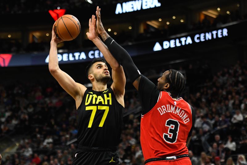 SALT LAKE CITY, UTAH - MARCH 06: Omer Yurtseven #77 of the Utah Jazz shoots over Andre Drummond #3 of the Chicago Bulls during the second half of a game at Delta Center on March 06, 2024 in Salt Lake City, Utah. NOTE TO USER: User expressly acknowledges and agrees that, by downloading and or using this photograph, User is consenting to the terms and conditions of the Getty Images License Agreement.  (Photo by Alex Goodlett/Getty Images)