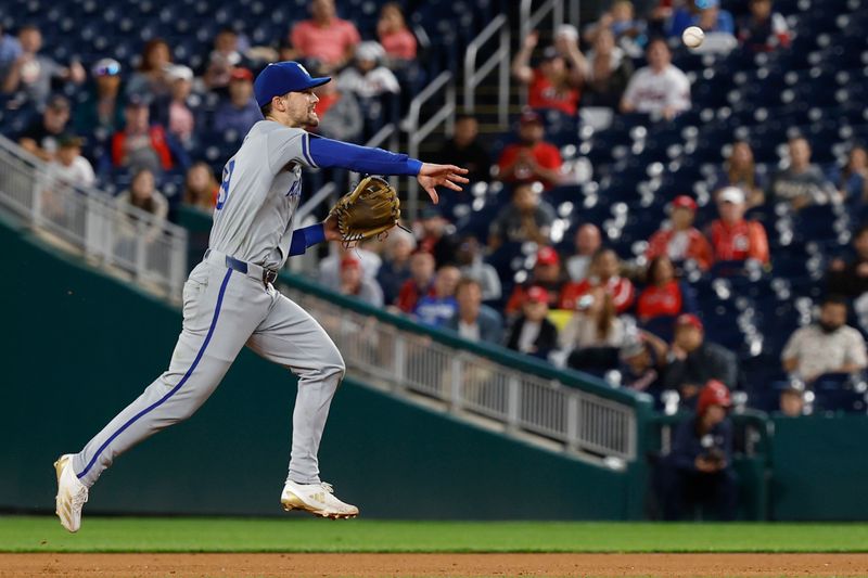 Sep 24, 2024; Washington, District of Columbia, USA; Kansas City Royals second baseman Michael Massey (19) makes a throw to first base on a ground ball by Washington Nationals first base Juan Yepez (not pictured) during the eighth inning at Nationals Park. Mandatory Credit: Geoff Burke-Imagn Images