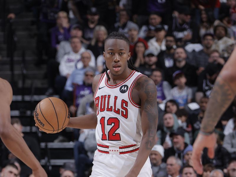 SACRAMENTO, CA - MARCH 4:  Ayo Dosunmu #12 of the Chicago Bulls handles the ball during the game against the Sacramento Kings on March 4, 2024 at Golden 1 Center in Sacramento, California. NOTE TO USER: User expressly acknowledges and agrees that, by downloading and or using this Photograph, user is consenting to the terms and conditions of the Getty Images License Agreement. Mandatory Copyright Notice: Copyright 2024 NBAE (Photo by Rocky Widner/NBAE via Getty Images)