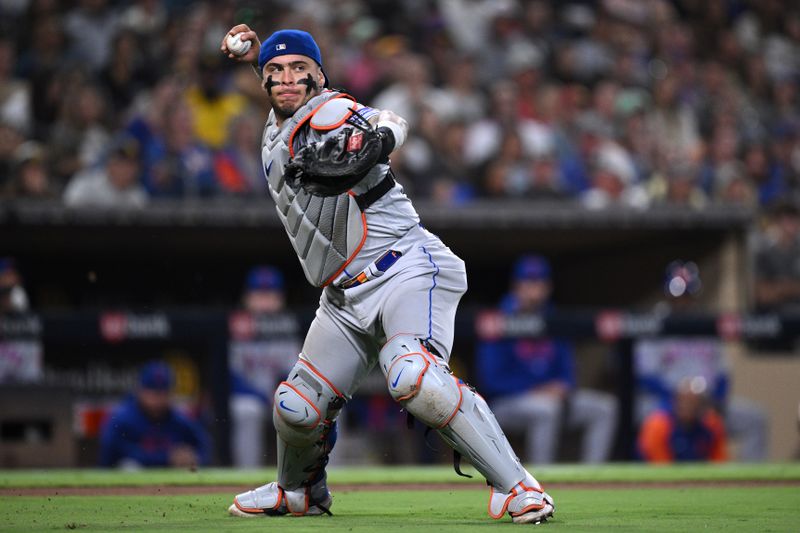 Jul 7, 2023; San Diego, California, USA; New York Mets catcher Francisco Alvarez (4) throws to first base on a ground out by San Diego Padres shortstop Xander Bogaerts (not pictured) during the eighth inning at Petco Park. Mandatory Credit: Orlando Ramirez-USA TODAY Sports