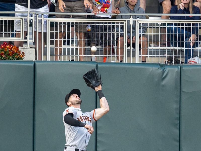 May 23, 2023; Minneapolis, Minnesota, USA; San Francisco Giants left fielder Mitch Haniger (17) catches a fly ball in the fourth inning against the Minnesota Twins at Target Field. Mandatory Credit: Jesse Johnson-USA TODAY Sports