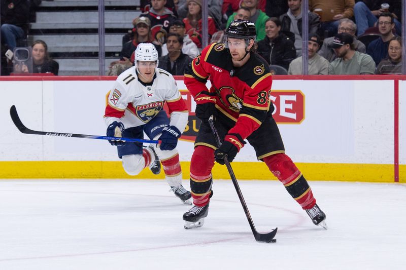 Jan 10, 2026; Ottawa, Ontario, CAN; Ottawa Senators defenseman Jake Sanderson (85) moves the puck as Florida Panthers right wing Mackie Saomskevich (11) chases in the second period at the Canadian Tire Centre. Mandatory Credit: Marc DesRosiers-IMAGN Images