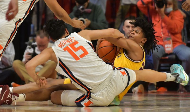 Feb 20, 2023; Champaign, Illinois, USA;  Minnesota Golden Gophers guard Jaden Henley (24) pulls a loose ball from the court as Illinois Fighting Illini guard RJ Melendez (15) moves to the ball during the second half at State Farm Center. Mandatory Credit: Ron Johnson-USA TODAY Sports