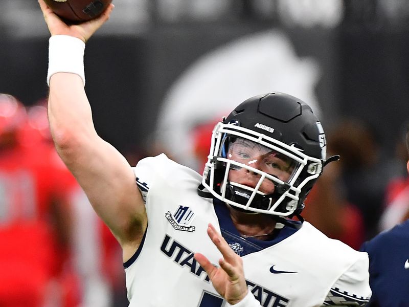 Oct 16, 2021; Paradise, Nevada, USA; Utah State Aggies quarterback Logan Bonner (1) warms up before a game against the UNLV Rebels at Allegiant Stadium. Mandatory Credit: Stephen R. Sylvanie-USA TODAY Sports