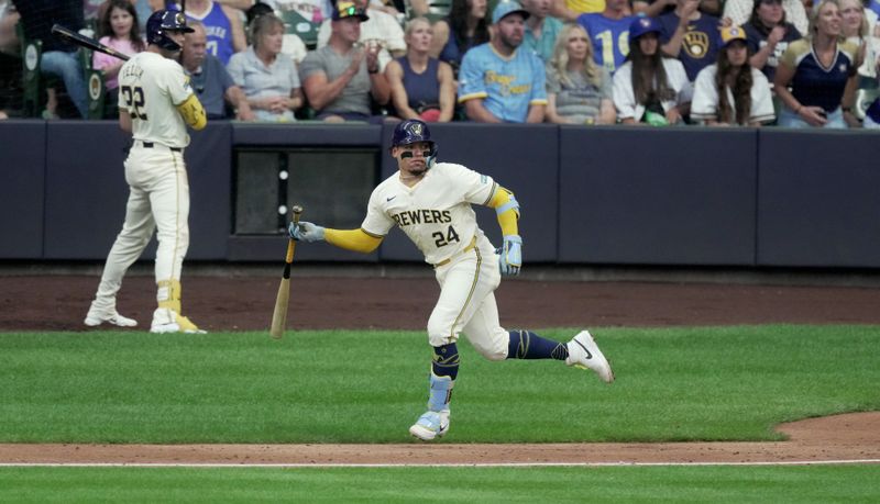 Jul 10, 2024; Milwaukee, Wisconsin, USA; Milwaukee Brewers catcher William Contreras (24) watches his two-run RBI double during the fourth inning against the Pittsburgh Pirates at American Family Field in Milwaukee, Wisconsin.  Mandatory Credit: Mark Hoffman-USA TODAY Sports