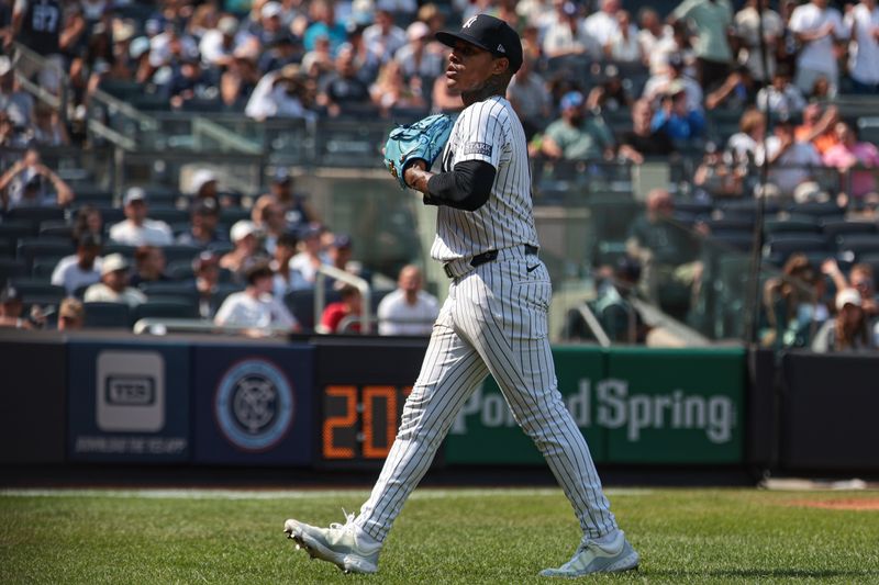 Aug 11, 2024; Bronx, New York, USA; New York Yankees starting pitcher Marcus Stroman (0) walks off the field after being relieved during the sixth inning against the Texas Rangers at Yankee Stadium. Mandatory Credit: Vincent Carchietta-USA TODAY Sports