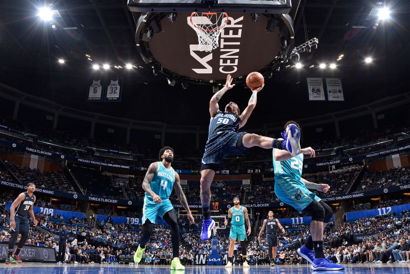 ORLANDO, FL - MARCH 19: Cole Anthony #50 of the Orlando Magic drives to the basket during the game against the Charlotte Hornets on March 19, 2024 at the Kia Center in Orlando, Florida. NOTE TO USER: User expressly acknowledges and agrees that, by downloading and or using this photograph, User is consenting to the terms and conditions of the Getty Images License Agreement. Mandatory Copyright Notice: Copyright 2024 NBAE (Photo by Fernando Medina/NBAE via Getty Images)