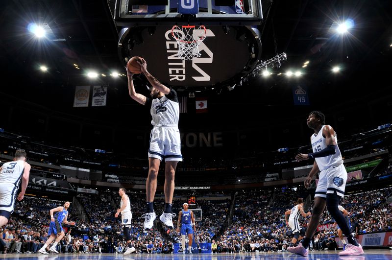 ORLANDO, FL - MARCH 30: Maozinha Pereira #25 of the Memphis Grizzlies rebounds the ball during the game against the Orlando Magic on March 30, 2024 at the Kia Center in Orlando, Florida. NOTE TO USER: User expressly acknowledges and agrees that, by downloading and or using this photograph, User is consenting to the terms and conditions of the Getty Images License Agreement. Mandatory Copyright Notice: Copyright 2024 NBAE (Photo by Fernando Medina/NBAE via Getty Images)