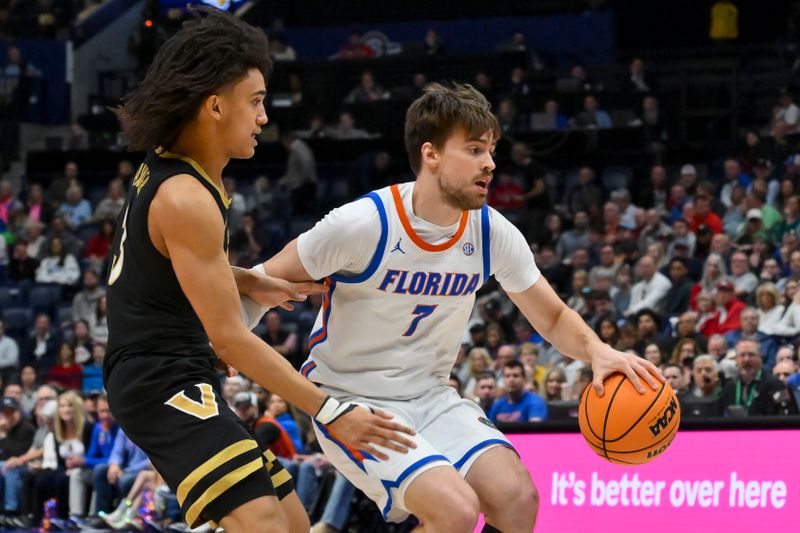 Mar 14, 2026; Nashville, TN, USA; Florida Gators guard Urban Klavzar (7) drives to the basket past Vanderbilt Commodores guard Tyler Tanner (3) during the first half at Bridgestone Arena. Mandatory Credit: Steve Roberts-Imagn Images Mar 14, 2026; Nashville, TN, USA; Florida Gators guard Urban Klavzar (7) drives to the basket past Vanderbilt Commodores guard Tyler Tanner (3) during the first half at Bridgestone Arena. Mandatory Credit: Steve Roberts-Imagn Images
