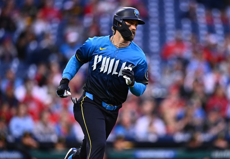 Apr 12, 2024; Philadelphia, Pennsylvania, USA; Philadelphia Phillies first baseman Bryce Harper (3) runs to first after hitting a single against the Pittsburgh Pirates in the first inning at Citizens Bank Park. Mandatory Credit: Kyle Ross-USA TODAY Sports