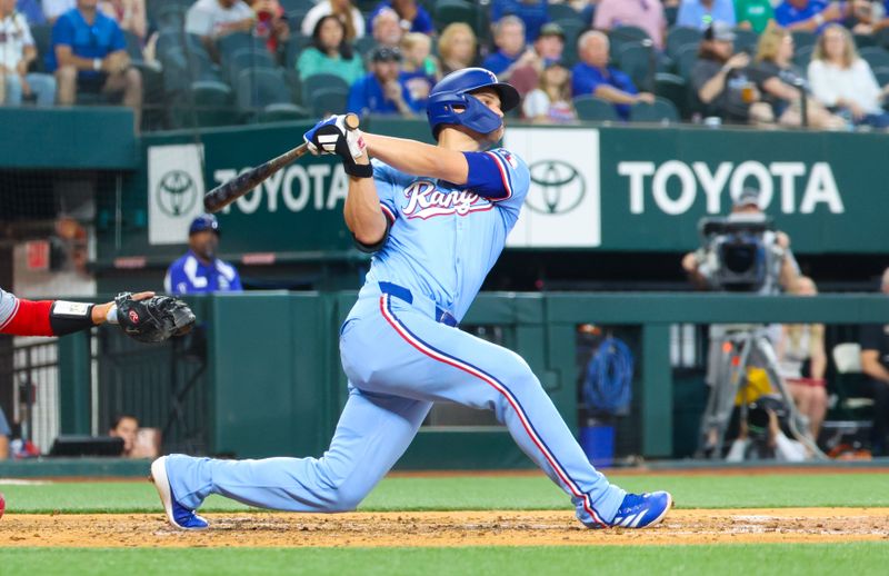 May 19, 2024; Arlington, Texas, USA; Texas Rangers shortstop Corey Seager (5) hits a home run during the fourth inning against the Los Angeles Angels at Globe Life Field. Mandatory Credit: Kevin Jairaj-USA TODAY Sports