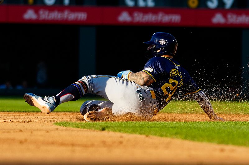 Jul 4, 2024; Denver, Colorado, USA; Milwaukee Brewers catcher William Contreras (24) slides into send base during the fifth inning against the Colorado Rockies at Coors Field. Mandatory Credit: Troy Babbitt-USA TODAY Sports

 