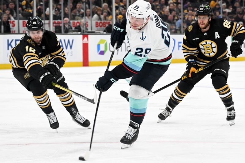 Feb 15, 2024; Boston, Massachusetts, USA; Seattle Kraken defenseman Vince Dunn (29) takes a shot in front of Boston Bruins center Pavel Zacha (18) during the second period at the TD Garden. Mandatory Credit: Brian Fluharty-USA TODAY Sports