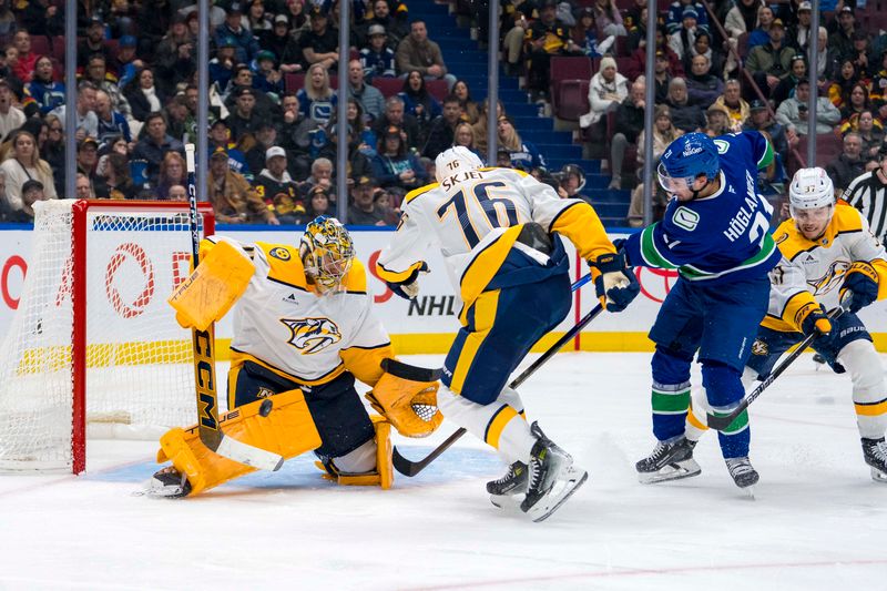 Jan 3, 2025; Vancouver, British Columbia, CAN; Nashville Predators defenseman Brady Skjei (76) and defenseman Nick Blankenburg (37) watch goalie Juuse Saros (74) make a save on Vancouver Canucks forward Nils Hoglander (21) in the second period at Rogers Arena. Mandatory Credit: Bob Frid-Imagn Images