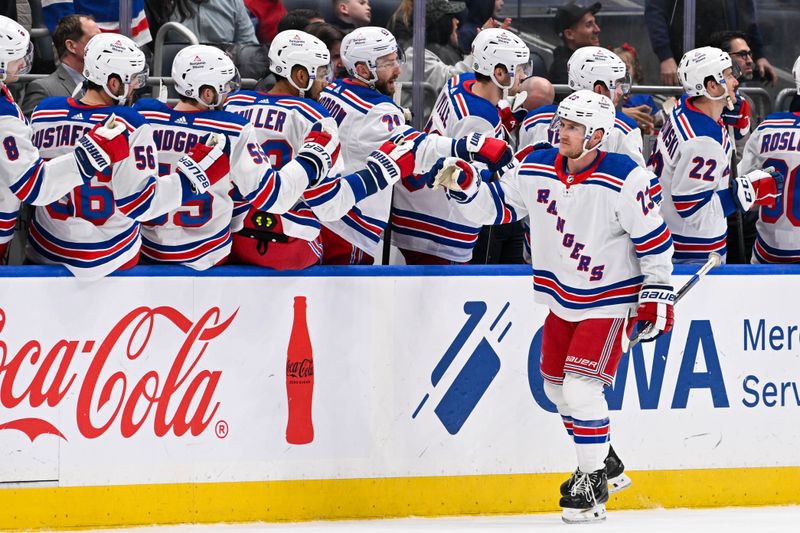 Apr 9, 2024; Elmont, New York, USA; New York Rangers defenseman Adam Fox (23) celebrates his goal against the New York Islanders during the second period at UBS Arena. Mandatory Credit: Dennis Schneidler-USA TODAY Sports