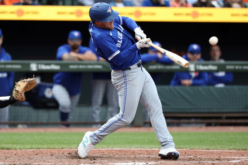Apr 13, 2025; Baltimore, Maryland, USA; Toronto Blue Jays outfielder Myles Straw (3) hits an RBI single during the sixth inning against the Baltimore Orioles at Oriole Park at Camden Yards. Mandatory Credit: Daniel Kucin Jr.-Imagn Images