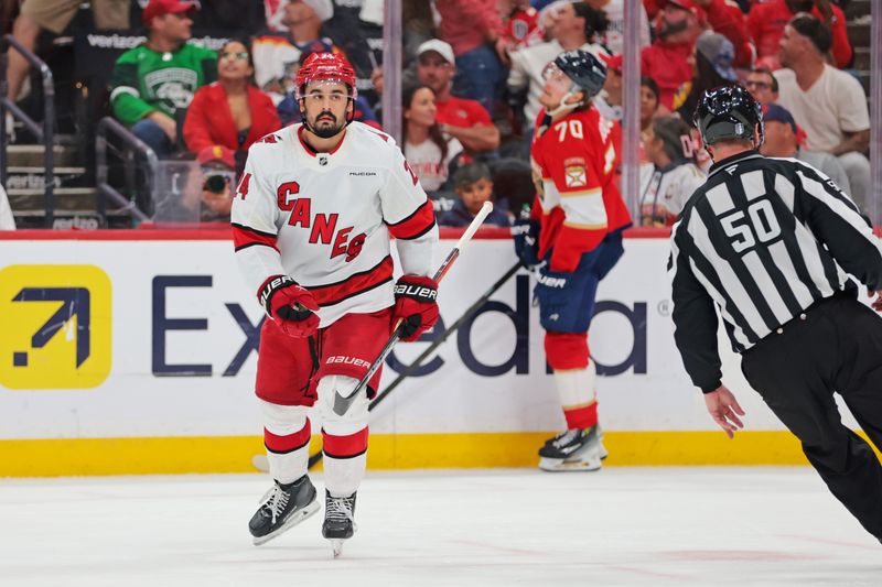 May 24, 2025; Sunrise, Florida, USA; Carolina Hurricanes center Seth Jarvis (24) celebrates after scoring a goal during the third period Florida Panthers in game three of the Eastern Conference Final of the 2025 Stanley Cup Playoffs at Amerant Bank Arena. Mandatory Credit: Sam Navarro-Imagn Images