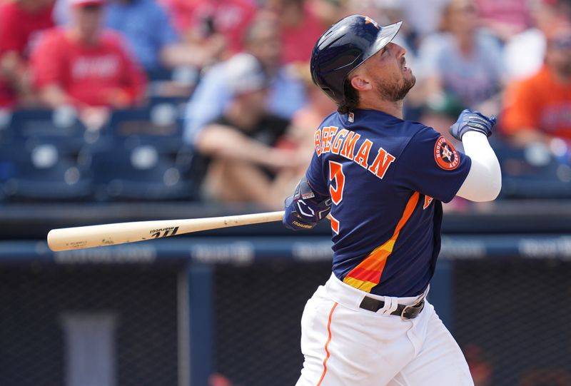 Mar 14, 2023; West Palm Beach, Florida, USA;  Houston Astros third baseman Alex Bregman (2) hits a sacrifice fly in the sixth inning against the St. Louis Cardinals at The Ballpark of the Palm Beaches. Mandatory Credit: Jim Rassol-USA TODAY Sports