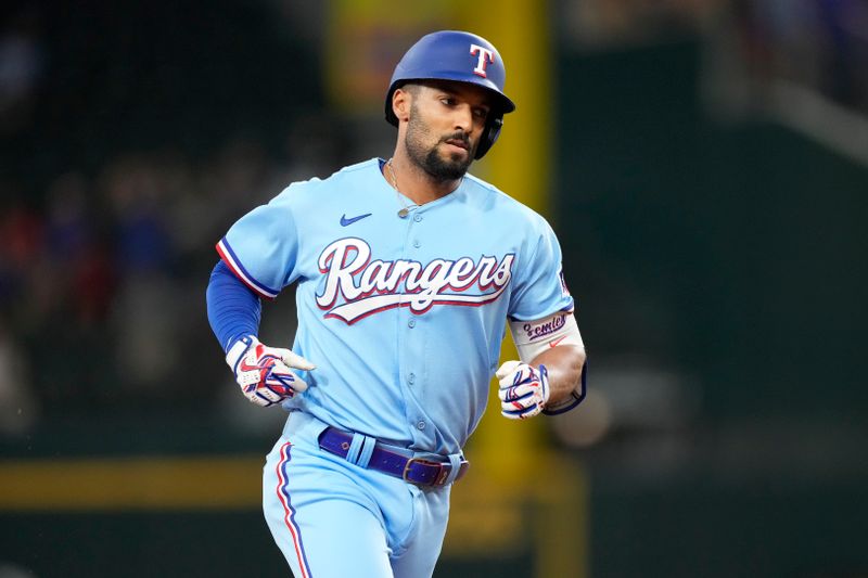 Jul 16, 2023; Arlington, Texas, USA; Texas Rangers second baseman Marcus Semien (2) circles the bases on his home run against the Cleveland Guardians during the first inning at Globe Life Field. Mandatory Credit: Jim Cowsert-USA TODAY Sports