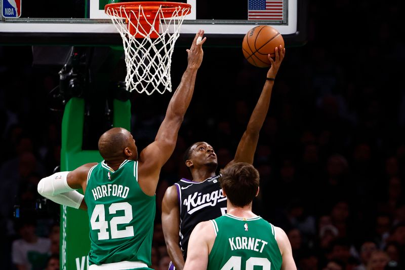 BOSTON, MA - APRIL 5: De'Aaron Fox #5 of the Sacramento Kings goes to the basket against Al Horford #42 of the Boston Celtics during the second quarter at TD Garden on April 5, 2024 in Boston, Massachusetts. NOTE TO USER: User expressly acknowledges and agrees that, by downloading and/or using this Photograph, user is consenting to the terms and conditions of the Getty Images License Agreement. (Photo By Winslow Townson/Getty Images)