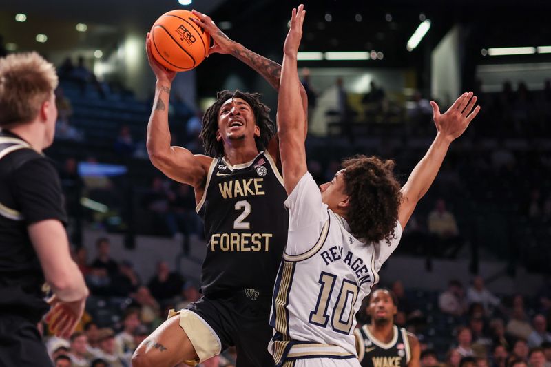 Feb 11, 2026; Atlanta, Georgia, USA; Wake Forest Demon Deacons guard Juke Harris (2) shoots past Georgia Tech Yellow Jackets guard Davi Remagen (10) in the first quarter at McCamish Pavilion. Mandatory Credit: Brett Davis-Imagn Images