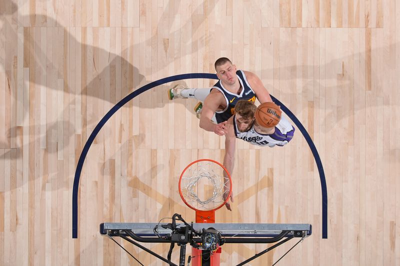 DENVER, CO - FEBRUARY 14: Domantas Sabonis #10 of the Sacramento Kings drives to the basket during the game against the Denver Nuggets on February 14, 2024 at the Ball Arena in Denver, Colorado. NOTE TO USER: User expressly acknowledges and agrees that, by downloading and/or using this Photograph, user is consenting to the terms and conditions of the Getty Images License Agreement. Mandatory Copyright Notice: Copyright 2024 NBAE (Photo by Bart Young/NBAE via Getty Images)