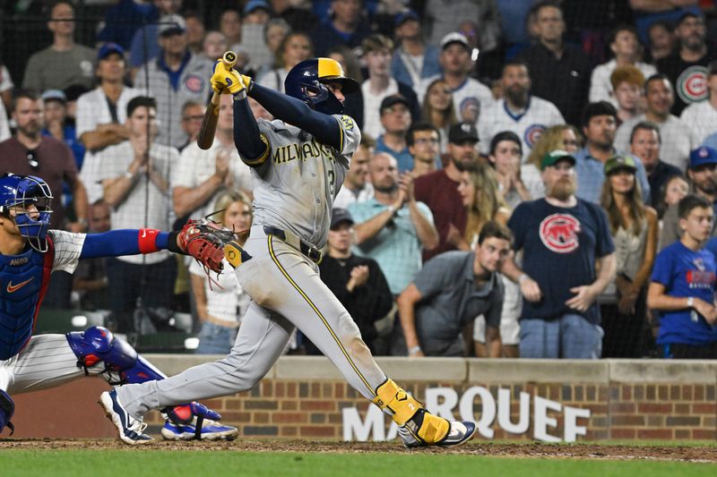 Jul 23, 2024; Chicago, Illinois, USA;  Milwaukee Brewers second baseman Brice Turang (2) hits an RBI single against the Chicago Cubs during the eighth inning at Wrigley Field. Mandatory Credit: Matt Marton-USA TODAY Sports