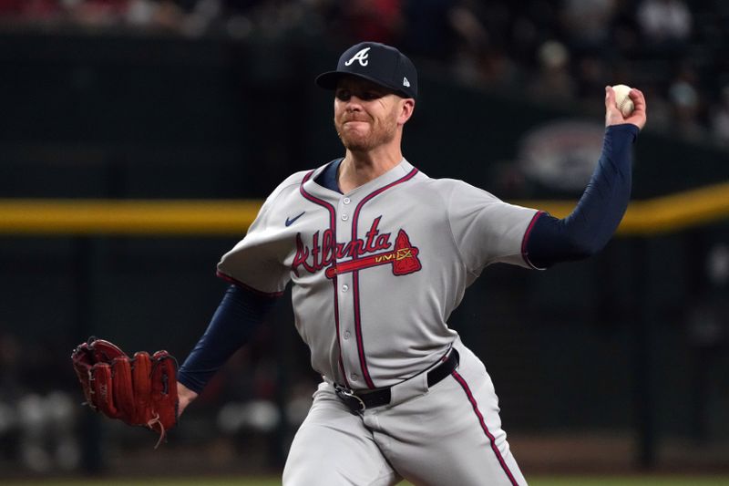 Apr 25, 2025; Phoenix, Arizona, USA; Atlanta Braves pitcher Aaron Bummer (49) throws against the Arizona Diamondbacks in the ninth inning at Chase Field. Mandatory Credit: Rick Scuteri-Imagn Images