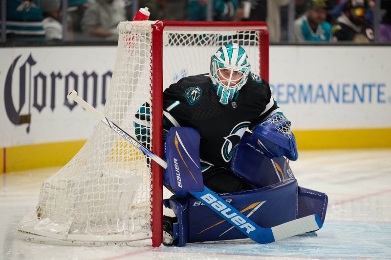 Mar 23, 2024; San Jose, California, USA; San Jose Sharks goaltender Devin Cooley (1) tends goal against the Chicago Blackhawks during the first period at SAP Center at San Jose. Mandatory Credit: Robert Edwards-USA TODAY Sports