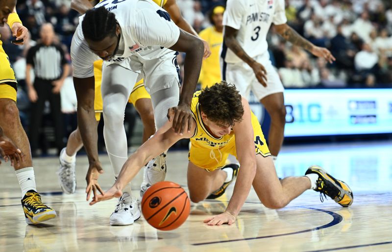 Jan 7, 2024; Philadelphia, Pennsylvania, USA; Michigan Wolverines forward Will Tschetter (42) dives for a loose ball against the Penn State Nittany Lions in the first half at The Palestra. Mandatory Credit: Kyle Ross-USA TODAY Sports