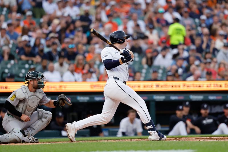 Jun 24, 2025; Detroit, Michigan, USA; Detroit Tigers second base Colt Keith (33) gets a hit in the first inning against the Athletics at Comerica Park. Mandatory Credit: Rick Osentoski-Imagn Images