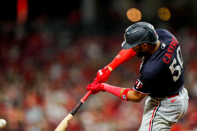 Sep 19, 2023; Cincinnati, Ohio, USA; Minnesota Twins center fielder Willi Castro (50) hits a two-run home run in the seventh inning against the Cincinnati Reds at Great American Ball Park. Mandatory Credit: Katie Stratman-USA TODAY Sports