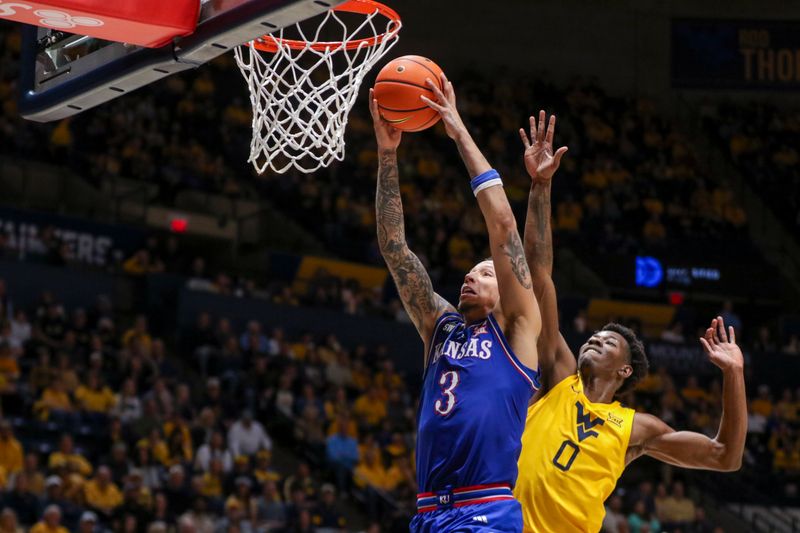 Jan 10, 2026; Morgantown, West Virginia, USA; Kansas Jayhawks guard Tre White (3) dunks the ball during the first half against the West Virginia Mountaineers at Hope Coliseum. Mandatory Credit: Ben Queen-Imagn Images